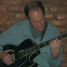 Peter Lothringer playing the guitar